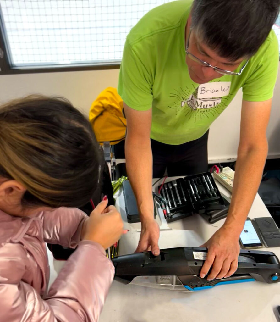 A cordless vacuum being worked on at a Repair Cafe. Image source: Leah Coulter